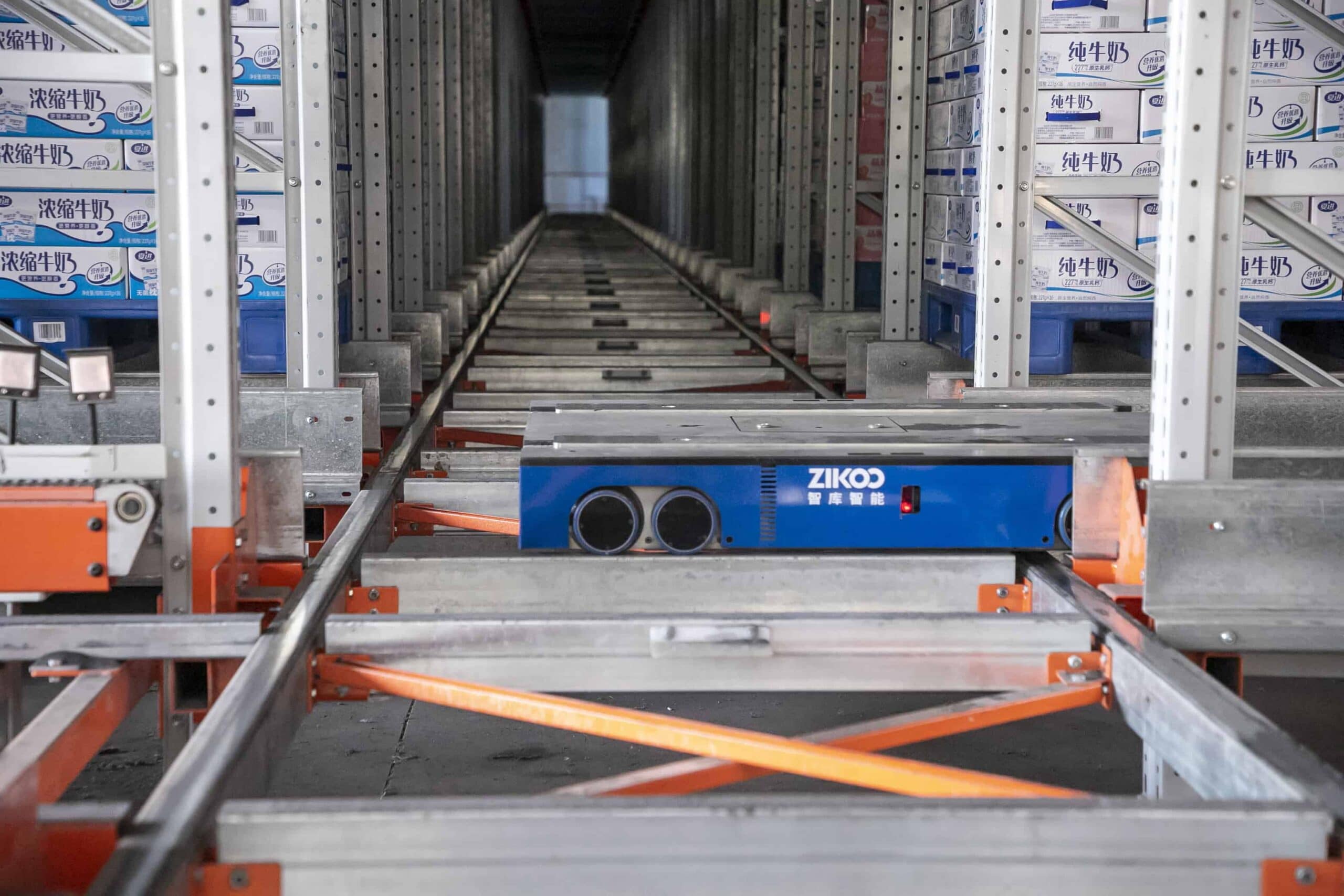 Zikoo Robotics R Bot Smart Four Way Pallet Shuttle Food And Dairy Enterprises Shelf To Person Scaled