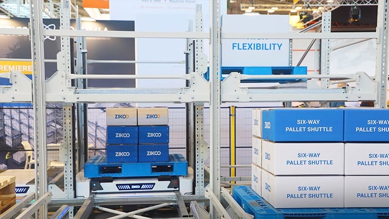 Zikoo Robotics six-way shuttle close-up showing integrated vertical lift and four-way movement for automated storage retrieval system