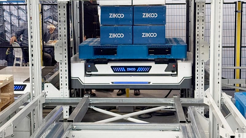 Zikoo Robotics six-way shuttle close-up showing integrated vertical lift and four-way movement for automated storage retrieval system