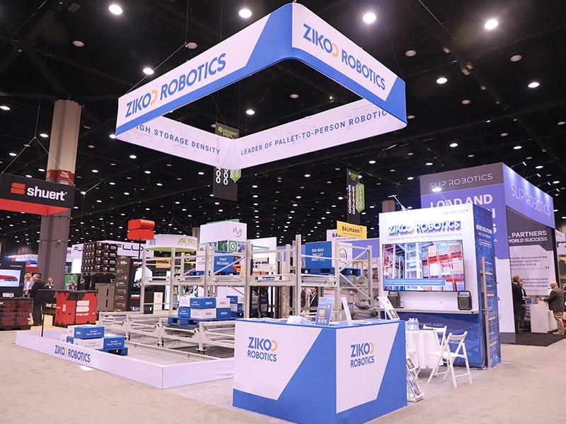 Zikoo Robotics showcasing six-way shuttle, four-way shuttle, and dense storage Automated Storage and Retrieval System at an international logistics exhibition